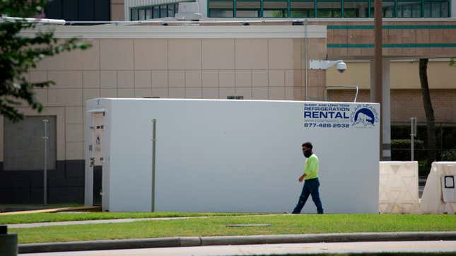 A refrigerated trailer sits outside of HCA Houston Healthcare Northwest in Texas on July 17, 2020. Hospitals in hard hit areas are once again being forced to store the dead elsewhere as their morgues fill up. 