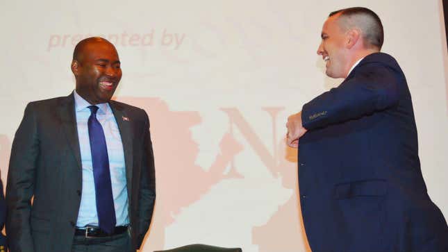 In this Sept. 8, 2016 photo, South Carolina Democratic Party Chairman Jaime Harrison and his GOP counterpart, Chairman Matt Moore, laugh after a recent voter education forum in Florence, S.C. Harrison has now announced his candidacy to unseat GOP Sen. Lindsey Graham of South Carolina in 2020.