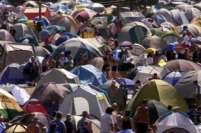 Refugees live in makeshift tents at Countryfest 2002.