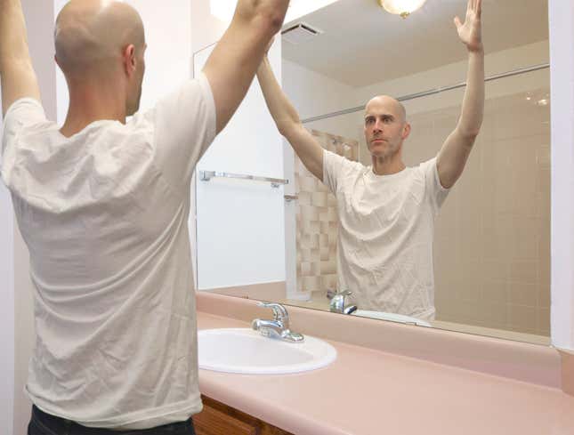 Image for article titled Self-Conscious NFL Referee Practices Raising Both Arms In Front Of Bathroom Mirror Before Game