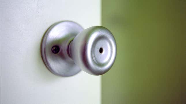 A doorknob on an opened door. 