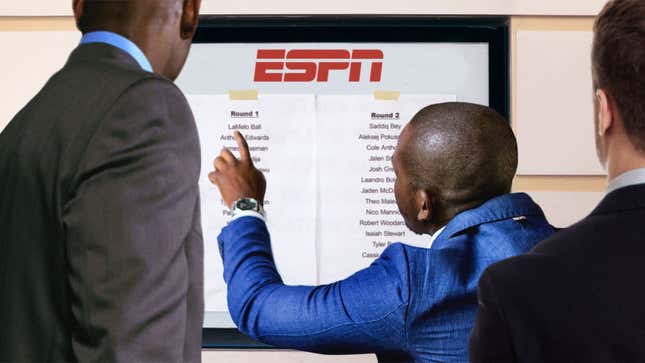 Image for article titled Desperate NBA Prospects Crowd Around List Taped To ESPN Bulletin Board To See Who Got Drafted