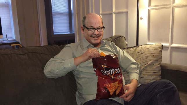 Image for article titled Middle-Aged Man Having Best Snacks Of His Life