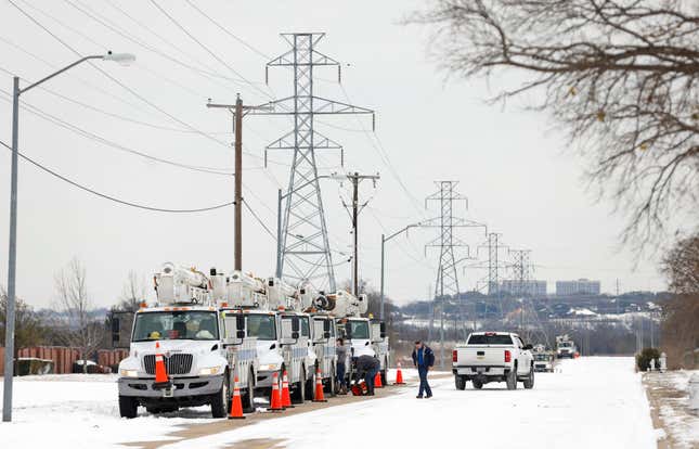 Pike Electric service trucks line up after a snow storm on February 16, 2021 in Fort Worth, Texas. Winter storm Uri has brought historic cold weather and power outages to Texas as storms have swept across 26 states with a mix of freezing temperatures and precipitation.