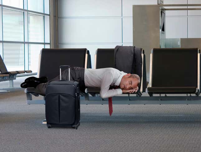 Image for article titled Sleeping Middle-Aged Businessman In Airport Suddenly So Childlike, So Vulnerable