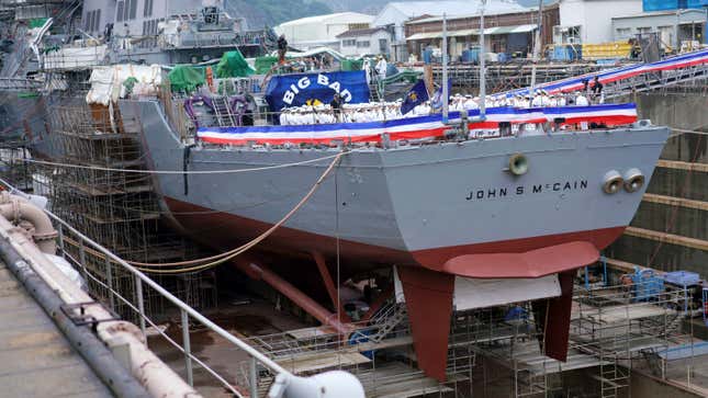 The USS John S. McCain undergoing repairs in dry dock at Yokosuka Naval Base in July, 2018.