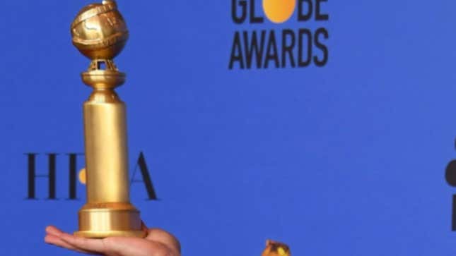 Darren Criss poses with the trophy during the 76th annual Golden Globe Awards on January 6, 2019.