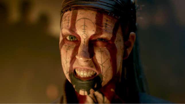 Hellblade 2: Senua's Saga protagonist Senua grits her teeth with warrior symbols painted over her face.