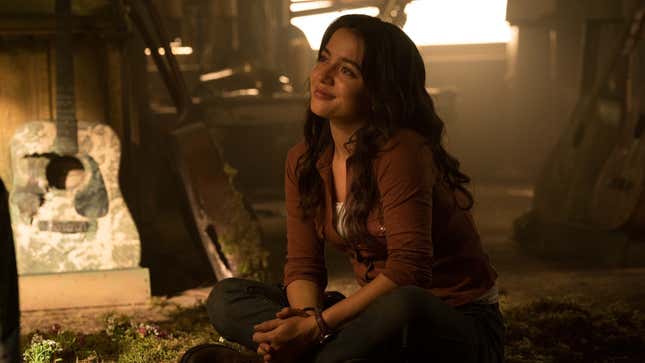 Dina looks lovingly at Ellie off-screen.