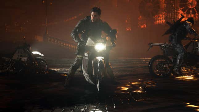 Neil sits on a motorcycle.