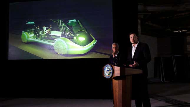 Elon Musk speaks at a press conference with Chicago Mayor Rahm Emanuel (left) about a new transportation system proposed by the Boring Company  on June 14, 2018, in  Chicago, Illinois. 