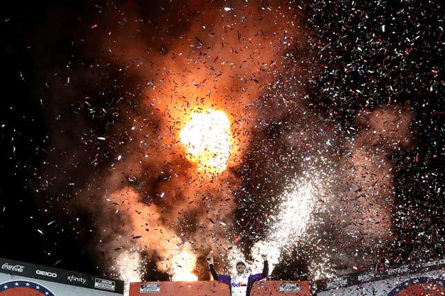 Denny Hamlin, driver of the No. 11 FedEx Ground Toyota, celebrates in victory lane after winning the NASCAR Cup Series Coca-Cola 600 at Charlotte Motor Speedway on May 29, 2022 in Concord, North Carolina.