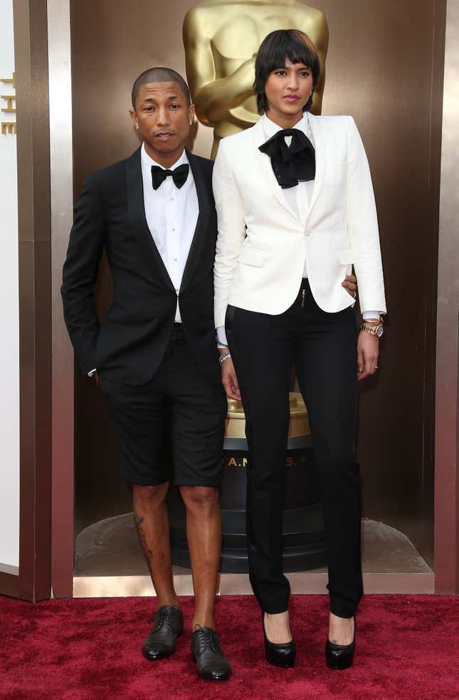 Pharrell Williams (L) and Helen Lasichanh arrive at the 86th Annual Academy Awards at Hollywood &amp; Highland Center on March 2, 2014 in Los Angeles, California.