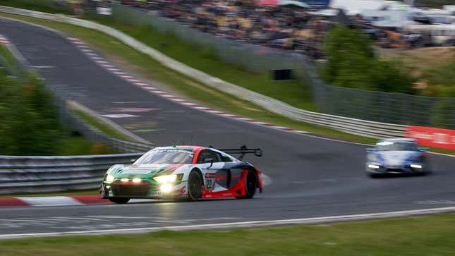 A photo of two cars racing in Germany. 