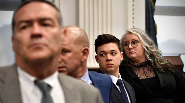 
Kyle Rittenhouse, third from left, stands with his legal team, from left, Mark Richards, Corey Chirafisi and Natalie Wisco as the jury leaves the room for the day at the Kenosha County Courthouse in Kenosha, Wis., on Friday, Nov. 5, 2021. 

