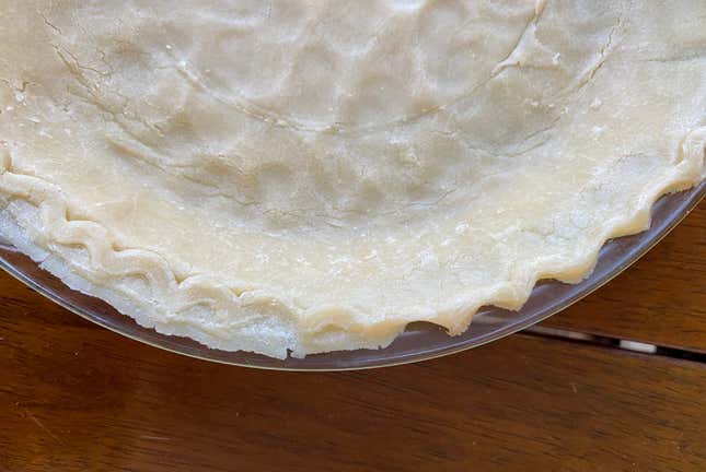 A pie crust with the edge crimped.