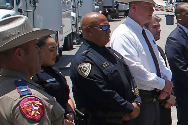 In this May 26, 2022, photo, Uvalde School Police Chief Pete Arredondo, third from left, stands during a news conference outside of the Robb Elementary school in Uvalde, Texas. Facing massive public pressure, Uvalde’s top school official has recommended the firing of the school district police chief who was central to the botched law enforcement response to the shooting at an elementary school that killed two teachers and 19 students.The city’s school board will consider firing Arrendondo at a special meeting Saturday, July 23, to consider the superintendent’s recommendation.