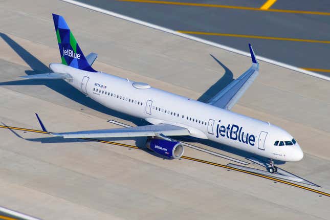 JetBlue airplane taxiing to gate after arriving at John F. Kennedy International Airport in New York.
