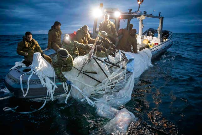 In this photo provided by the U.S. Navy, sailors assigned to Explosive Ordnance Disposal Group 2 recover a high-altitude surveillance balloon off the coast of Myrtle Beach, S.C., Feb. 5, 2023. A missile fired on Feb. 5 by a U.S. F-22 off the Carolina coast ended the days-long flight of what the Biden administration says was a surveillance operation that took the Chinese balloon near U.S. military sites. It was an unprecedented incursion across U.S. territory for recent decades, and raised concerns among Americans about a possible escalation in spying and other challenges from rival China.