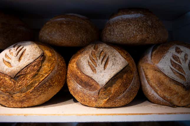 FILE - Freshly baked bread is displayed in Babushka Bakery in Budapest on Tuesday, April 11, 2023. Global prices for food commodities like grain and vegetable oil fell last year from record highs in 2022, when Russia’s war in Ukraine, drought and other factors helped worsen hunger worldwide, the U.N. Food and Agriculture Organization said Friday, Jan. 5, 2024. (AP Photo/Denes Erdos, File)