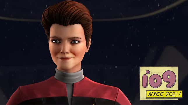 An animated Captain Kathryn Janeway stands smiling aboard the bridge of the U.S.S. Protostar.