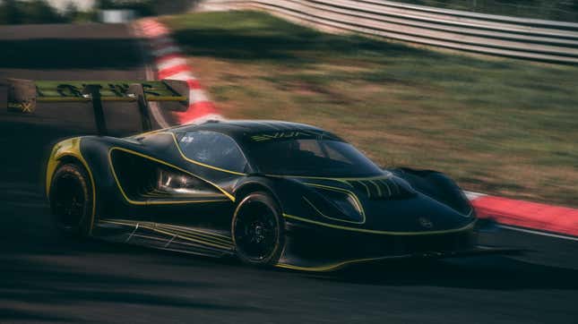 A photo of the Lotus Evija X racing on a track. 