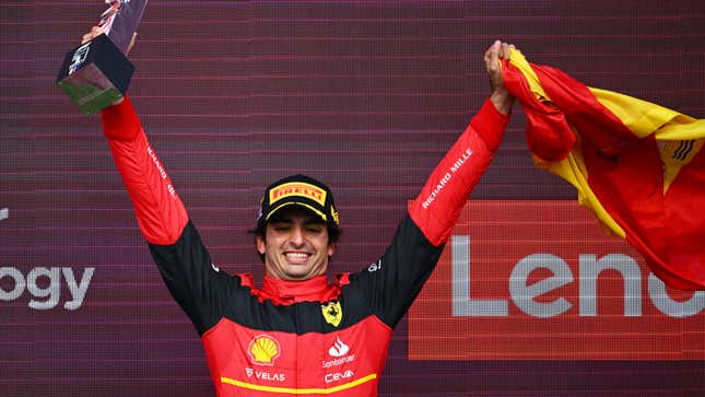 A photo of Ferrari driver Carlos Sainz on the podium at Silverstone. 