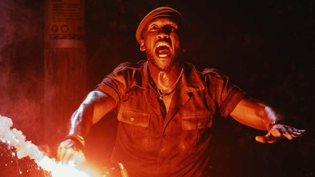 An image shows a person holding a flare and screaming as seen in Jurassic World Rebirth. 