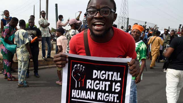 A man carries a banner calling for the end to the Twitter ban during a demonstration at Ojota in Lagos, Nigeria on June 12, 2021.