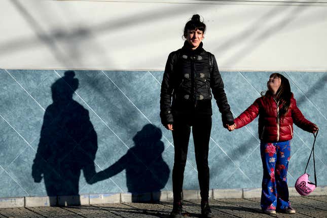 Yesica Leone, 30, and her 6-year-old daughter Mia, pose for a photo in Buenos Aires, Argentina, Monday, Sept. 25, 2023. Leone, now unemployed, made a living as a cosmetologist until the coronavirus pandemic hit. Although she receives government assistance it is not enough to cover basic needs she says. (AP Photo/Natacha Pisarenko)