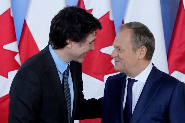 Poland&#39;s Prime Minister Donald Tusk, right, greets Canada&#39;s Prime Minister Justin Trudeau ahead of talks on European security and support for Poland&#39;s neighbor, Ukraine, in its struggle against Russia&#39;s aggression, in Warsaw, Poland, on Monday, Feb. 26, 2024. Trudeau is in Poland after a visit to Kyiv. (AP Photo/Czarek Sokolowski)