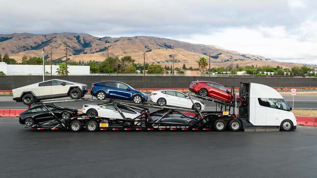 Tesla Semi truck pulling a trailer full of Teslas