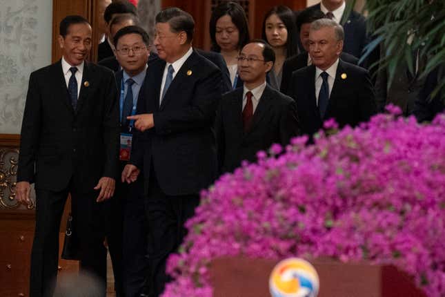 Chinese President Xi Jinping, third form left, chats with Indonesian President Joko Widodo, left, as they and other foreign leaders arrive at the opening ceremony for The Third Belt and Road Forum at the Great Hall of the People in Beijing, Wednesday, Oct. 18, 2023. Xi is promising foreign companies more access to China&#39;s huge market and more than $100 billion in new financing for other developing economies. (AP Photo/Ng Han Guan)