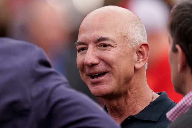 FILE - Amazon founder Jeff Bezos is seen on the sidelines before the start of an NFL football game between the Kansas City Chiefs and the Los Angeles Chargers Thursday, Sept. 15, 2022, in Kansas City, Mo. Bezos’ fund to support homeless families announced $117 million in new grants on Tuesday, Nov. 21, 2023 to organizations across the U.S. and Puerto Rico. The grants are a part of a $2 billion commitment Bezos made in 2018 to support homeless families and to run free preschools. (AP Photo/Charlie Riedel, File)