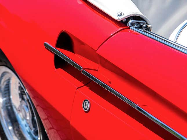 Door handle of a red 1967 Ferrari 365 California Spyder