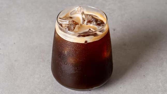 Drip coffee with ice cubes in glass