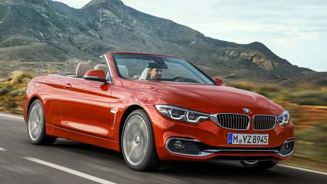 A photo of an orange BMW convertible. 