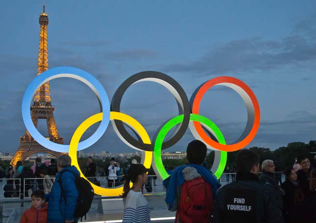 FILE - The Olympic rings are set up on Trocadero plaza that overlooks the Eiffel Tower, a day after the official announcement that the 2024 Summer Olympic Games will be in the French capital, in Paris, France, Thursday, Sept. 14, 2017. The 2024 Paris Olympics are set to be played this summer in some iconic venues that have deep historical significance. Many events will take place in Paris, including fencing and taekwondo at the Grand Palais des Champs-Élysées, and beach volleyball at the base of the Eiffel Tower. (AP Photo//Michel Euler, File)