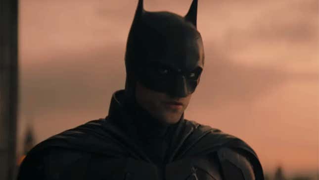 Robert Pattinson's Batman glowers in the haze of a Gotham sunset.