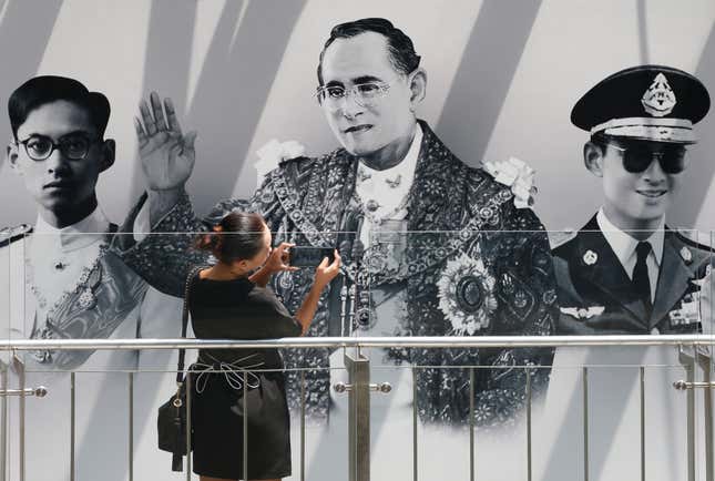 Portraits of the late king on display in front of a shopping center in Bangkok this week.