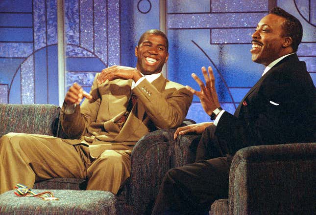 Earvin “Magic” Johnson, a player on the U.S. Olympic basketball “Dream Team,” left, and Arsenio Hall talk during taping of Hall’s show in Los Angeles, Monday, August 11, 1992.