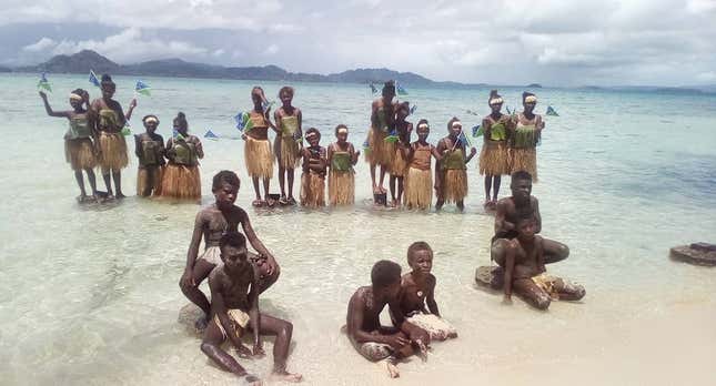 Students attend a climate change protest on Marovo Island, Solomon Islands, Sept. 20.