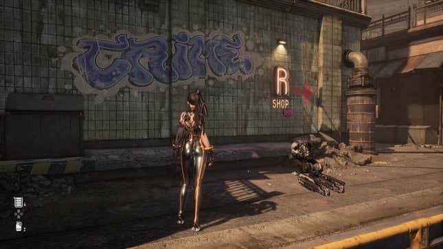 Eve looks at graffiti on the side of a wall. 