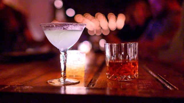 Two cocktails on a wooden bar