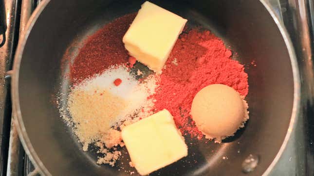 Spices and butter in a small pot.