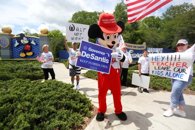 Republican supporters holding placards in support of a bill outside Disney World in Orlando, Florida
