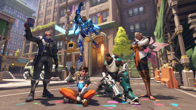 Soldier 76, Tracer, Pharah, Baptiste, and Lifeweaver are seen standing in the Midtown street with Pride decorations surrounding them.