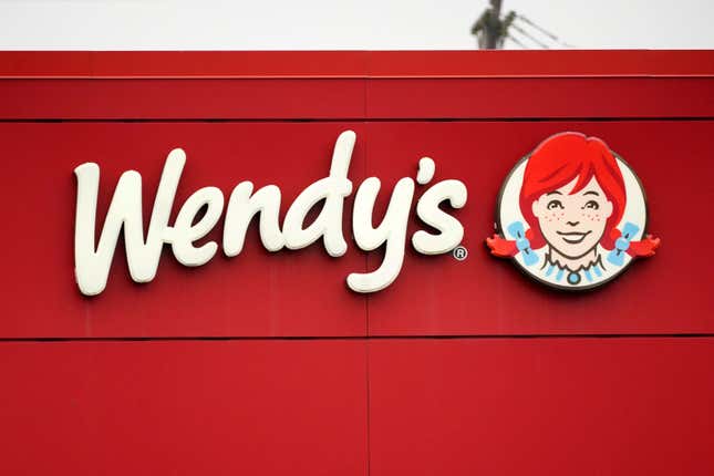 FILE - The Wendy&#39;s sign is seen at a restaurant, Jan. 23, 2023, in Pittsburgh. Wendy&#39;s is looking to test having the prices of its menu items fluctuate throughout the day based on demand, implementing a strategy that has already taken hold with ride-sharing companies and ticket sellers. (AP Photo/Gene J. Puskar, File)