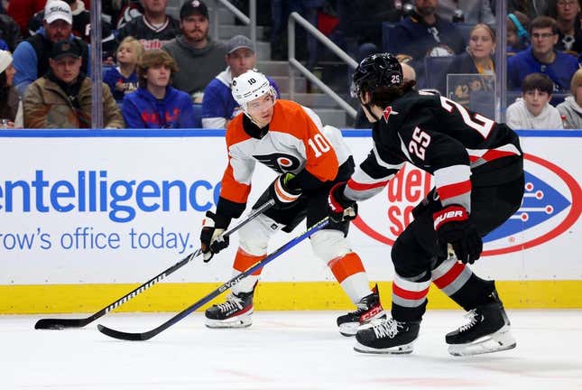 Nov 3, 2023; Buffalo, New York, USA;  Philadelphia Flyers right wing Bobby Brink (10) looks to make a pass as Buffalo Sabres defenseman Owen Power (25) defends during the first period at KeyBank Center.