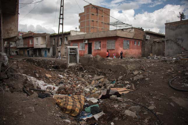 A crater left by a bomb blast in Diyarbakir. Fighting began shortly after a curfew was imposed on the city on Dec. 2, 2015.
